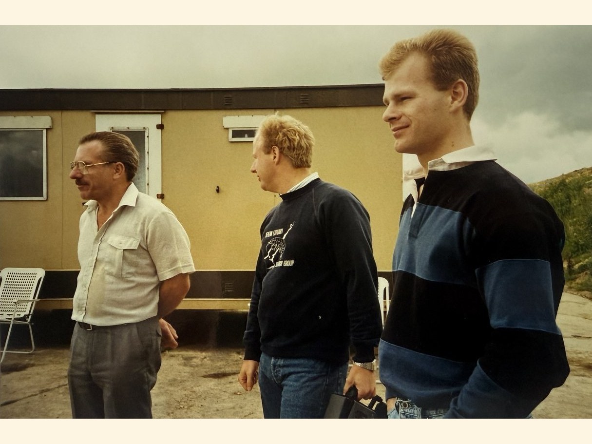 A 1988 family photograph of Ken with his sons Kevin and Chris outside a site cabin