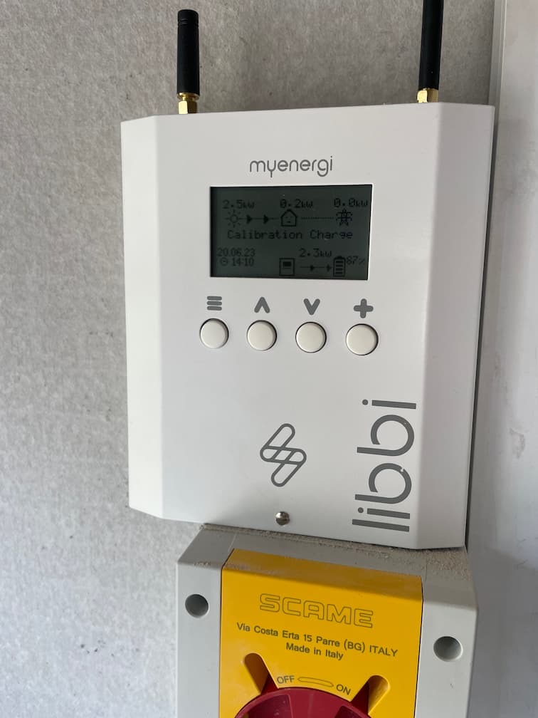 Close view of the myenergi Libbi display showing a calibration charge in progress